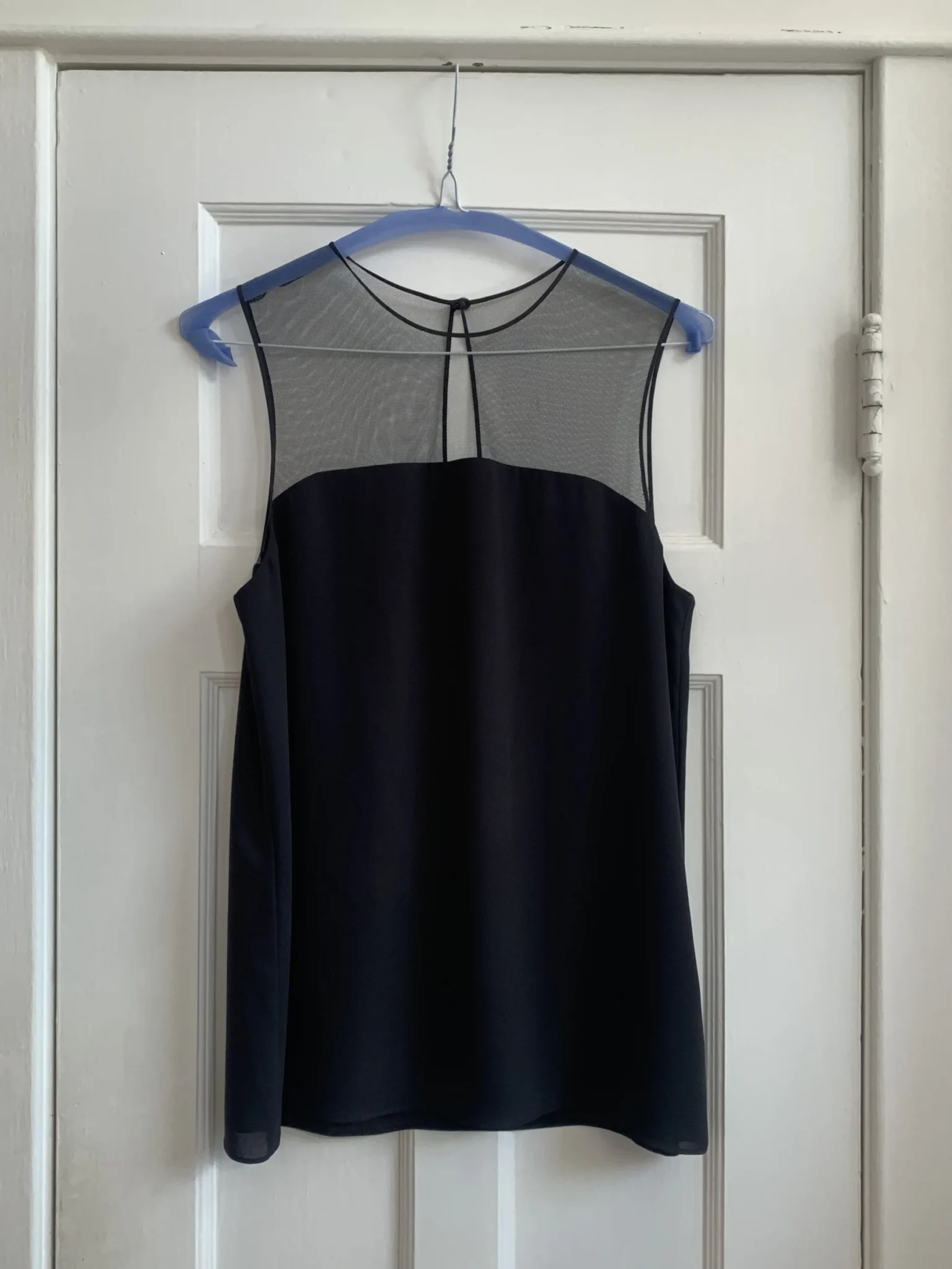 Featured image for Black sleeveless blouse