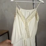 Thumbnail for A lightweight, flowing fabric jumpsuit with embroidery