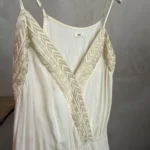 Thumbnail for A lightweight, flowing fabric jumpsuit with embroidery