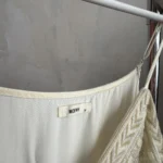 Thumbnail for A lightweight, flowing fabric jumpsuit with embroidery