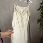 Thumbnail for A lightweight, flowing fabric jumpsuit with embroidery