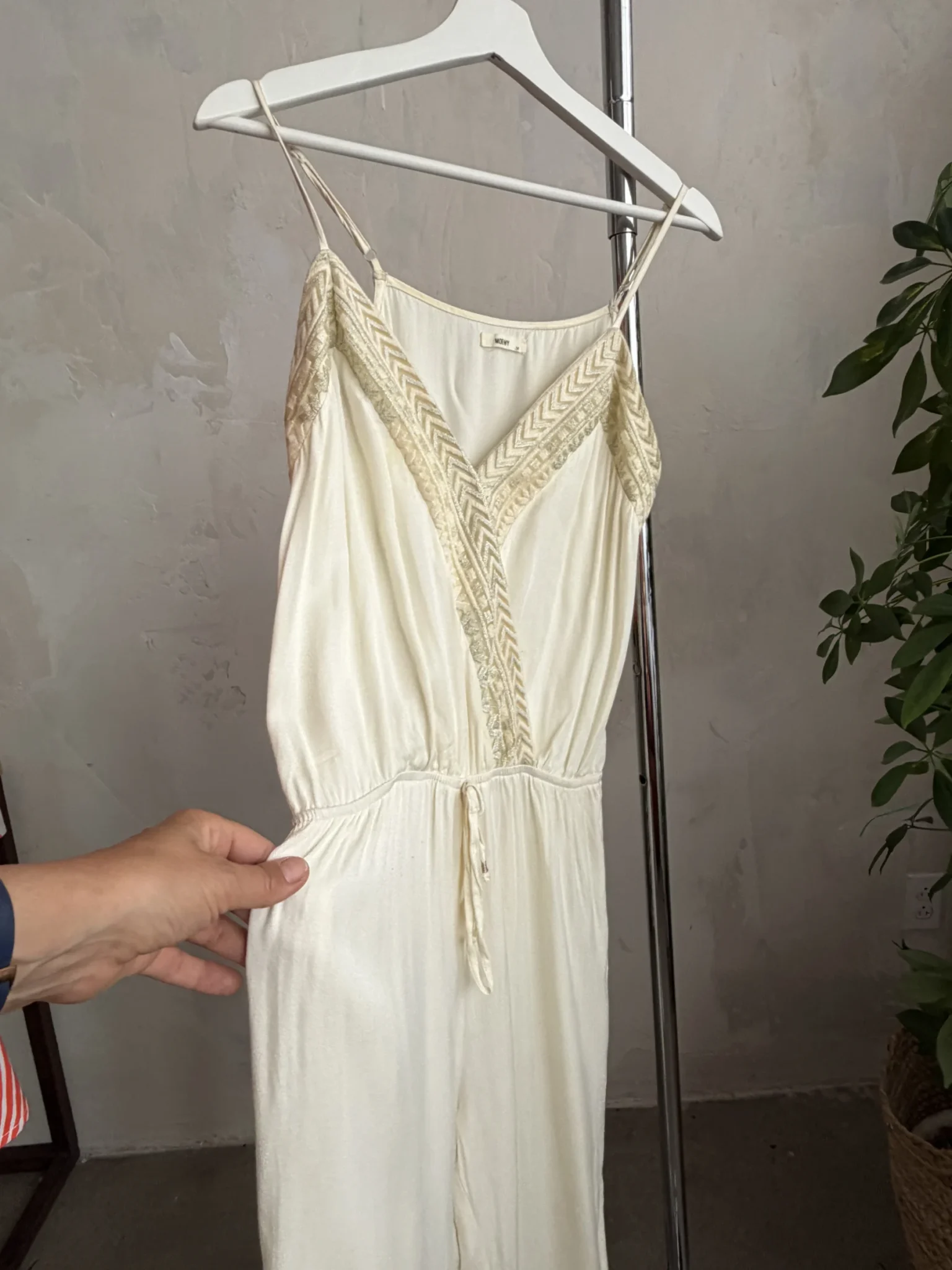 Image for A lightweight, flowing fabric jumpsuit with embroidery