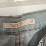 Thumbnail for Mid-length Levi’s shorts