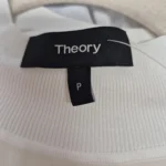 Thumbnail for : Top sans manches en soie blanche Theory – Col en maille côtelée –