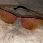 Featured thumbnail for Ray-Ban Rimless Sunglasses with Red-Tinted Lenses