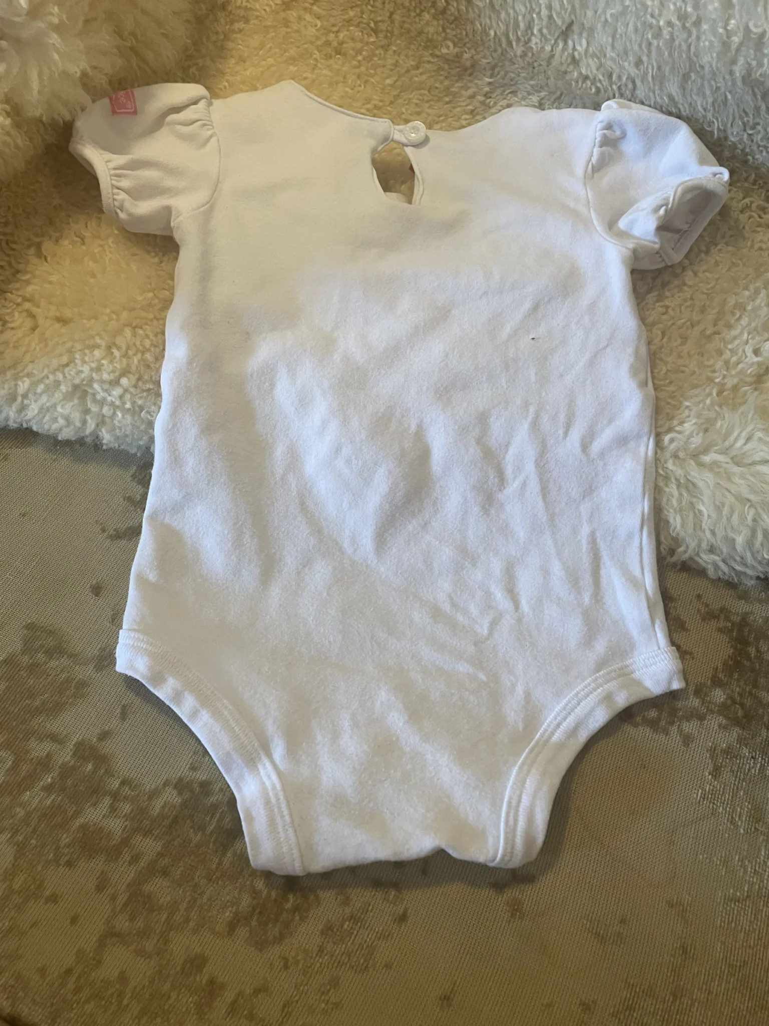 Image for 12-month-old romper, runs small