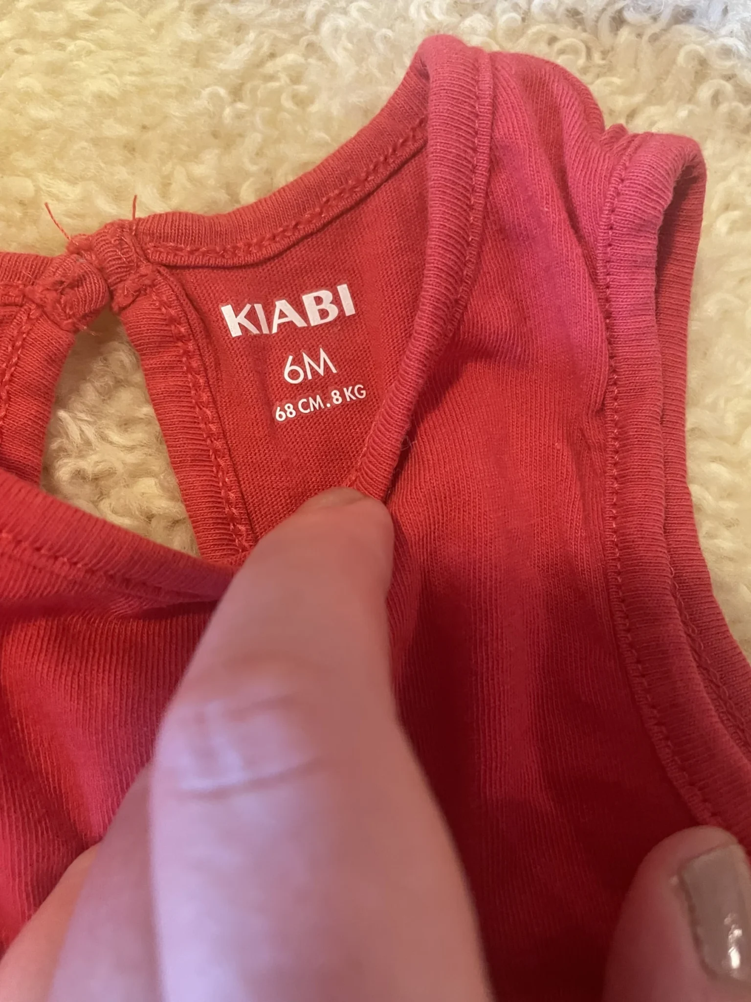 Image for 6-month-old baby vest, made a size larger