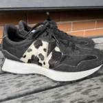 Featured thumbnail for Black New Balance trainers with an animal print