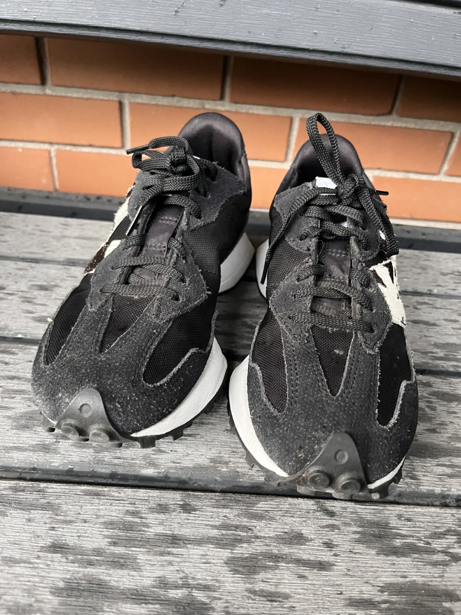 Image for Black New Balance trainers with an animal print