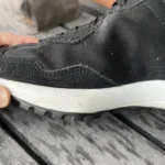 Thumbnail for Black New Balance trainers with an animal print