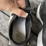 Thumbnail for Black New Balance trainers with an animal print
