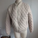 Featured thumbnail for Cream-coloured puffer jacket