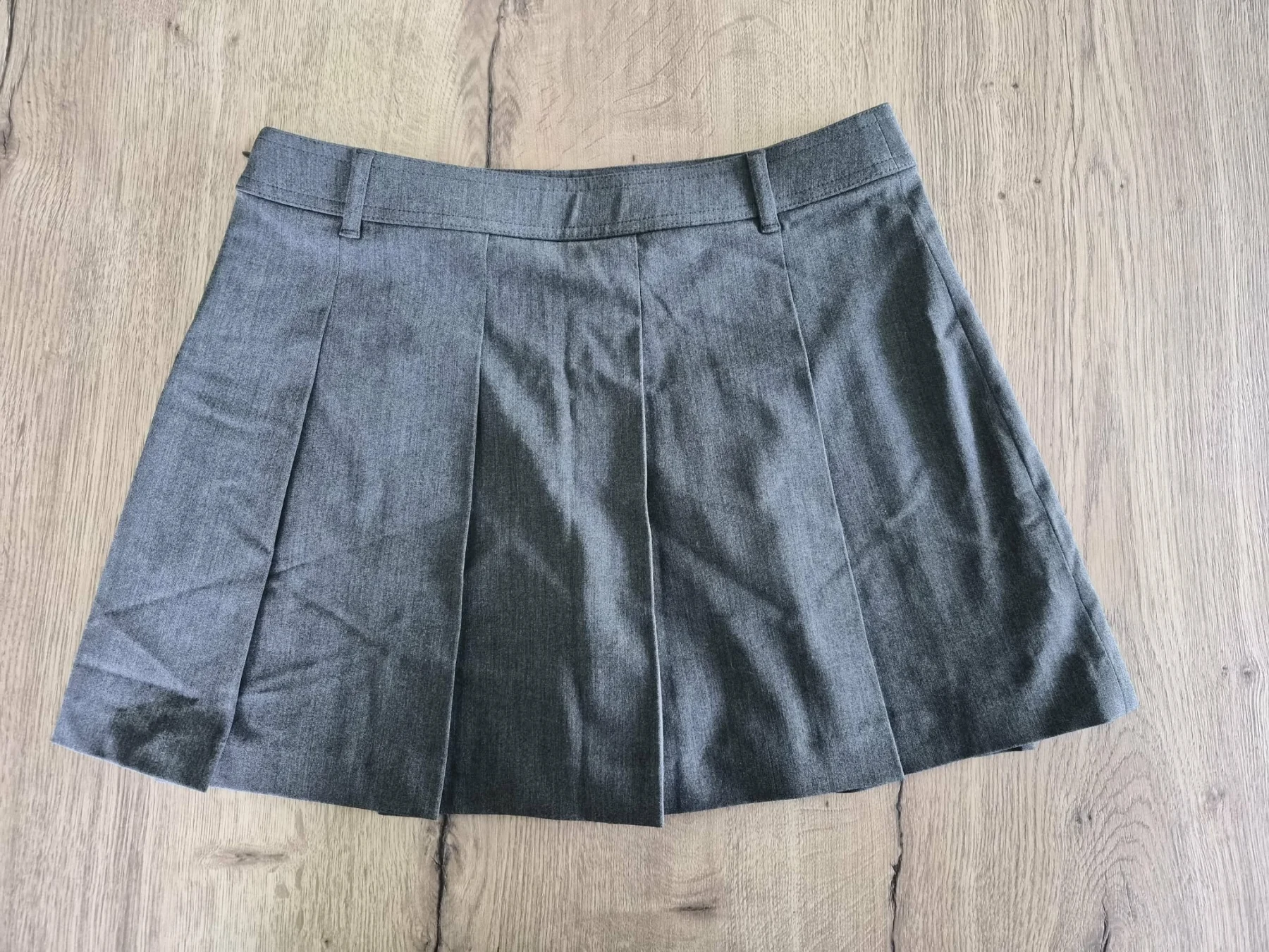 Mini jupe plissée Uniqlo seconde main