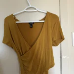 Featured thumbnail for Yellow wrap-around jumper