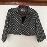 Featured thumbnail for Mad Cap England – Black and white cropped jacket with a geometric pattern