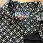 Thumbnail for Mad Cap England – Black and white cropped jacket with a geometric pattern