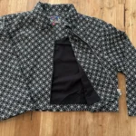 Thumbnail for Mad Cap England – Black and white cropped jacket with a geometric pattern