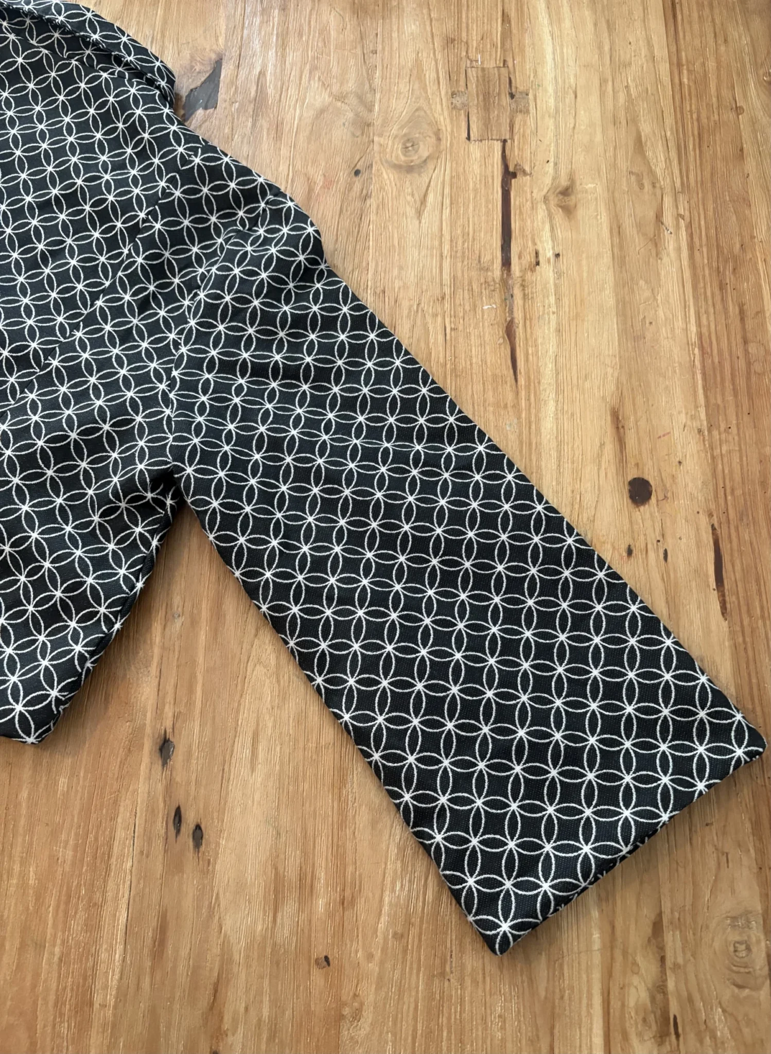 Image for Mad Cap England – Black and white cropped jacket with a geometric pattern