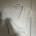 Featured thumbnail for Crop-length wrap-round jumper