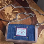 Featured thumbnail for True Religion – Denim crossbody bag with tan leather trim