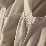 Thumbnail for A pretty, flowing sleeveless blouse.