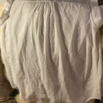 Thumbnail for A pretty, flowing sleeveless blouse.