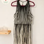 Featured thumbnail for Black and ivory pleated midi dress