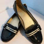 Featured thumbnail for Coach Poppy – Black and gold patent leather ballet flats – Size 8