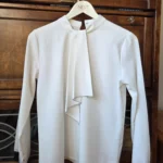 Featured thumbnail for Blouse ivoire pâle à volants