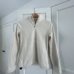 Featured thumbnail for Cream-coloured half-zip jumper