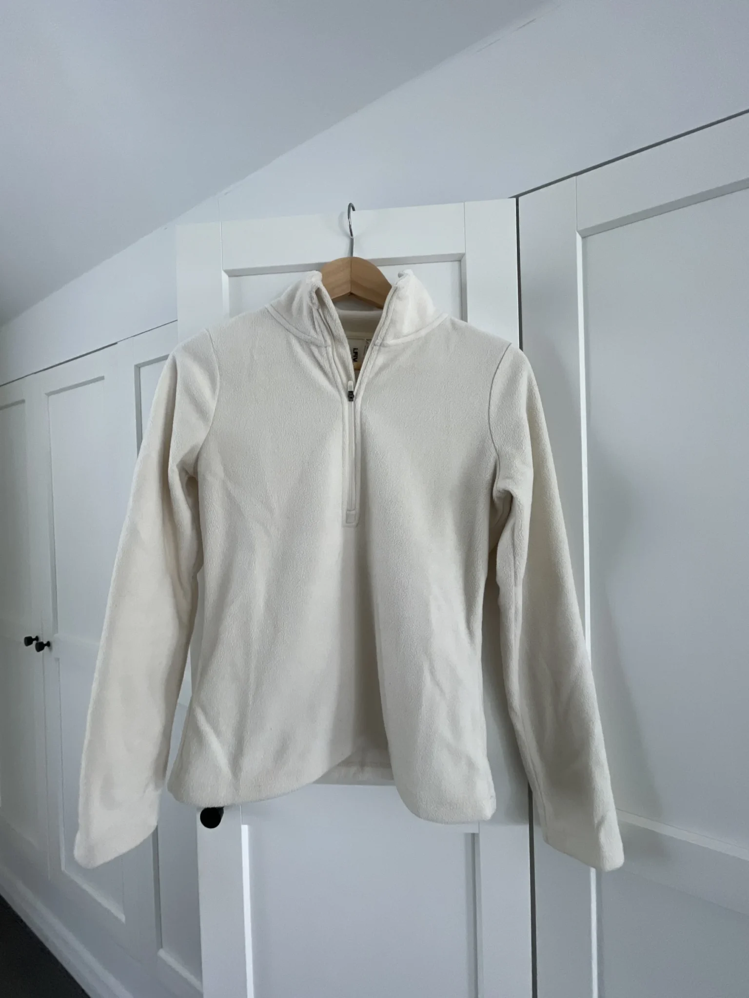 Featured image for Cream-coloured half-zip jumper