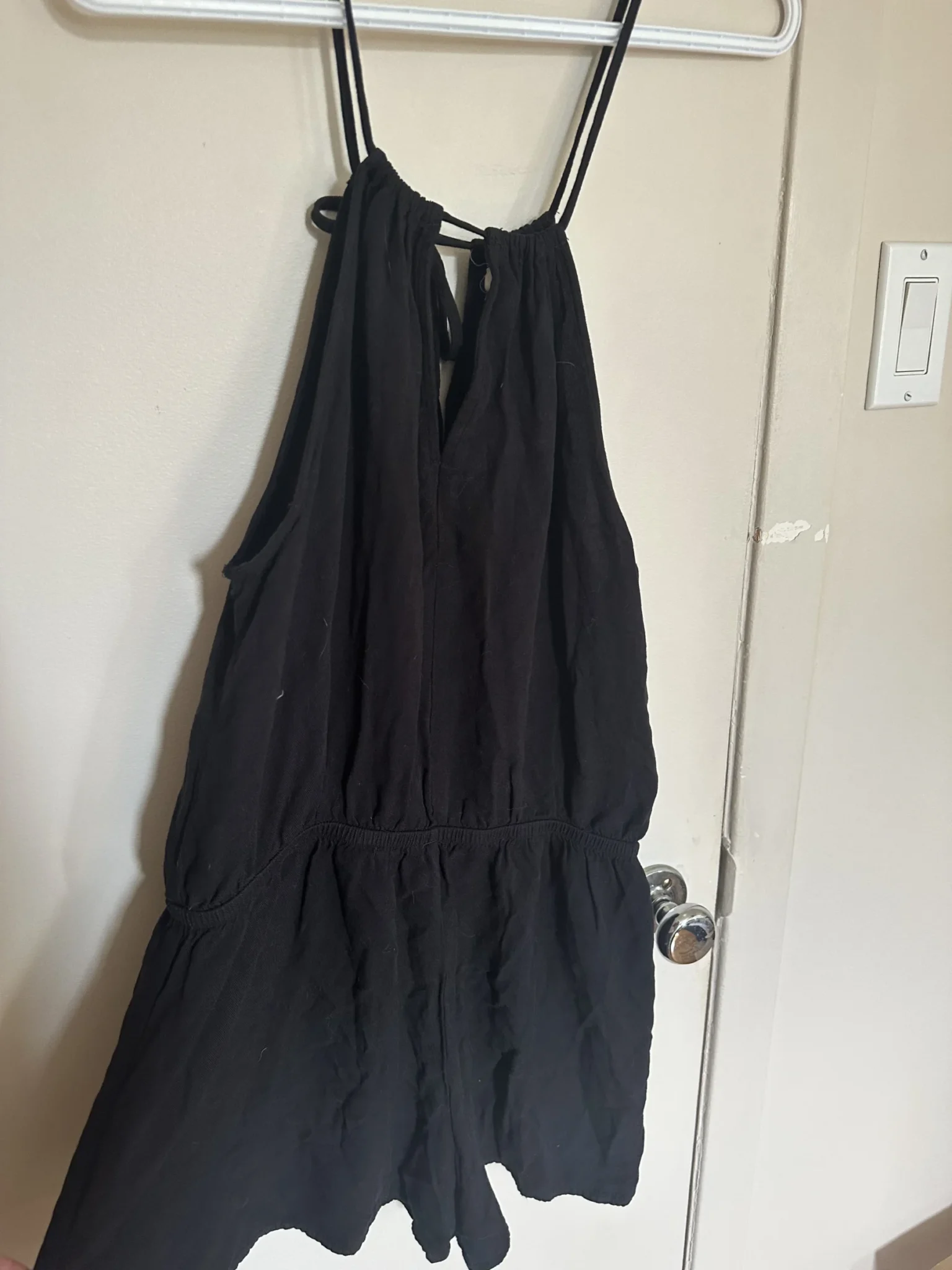 Image for One-piece with a neck strap