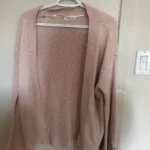 Featured thumbnail for Wide-sleeved cardigan with a bow