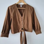 Featured thumbnail for Short blouse with a bow at the front