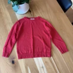 Featured thumbnail for red long-sleeved jumper