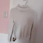 Featured thumbnail for White ribbed roll-neck jumper