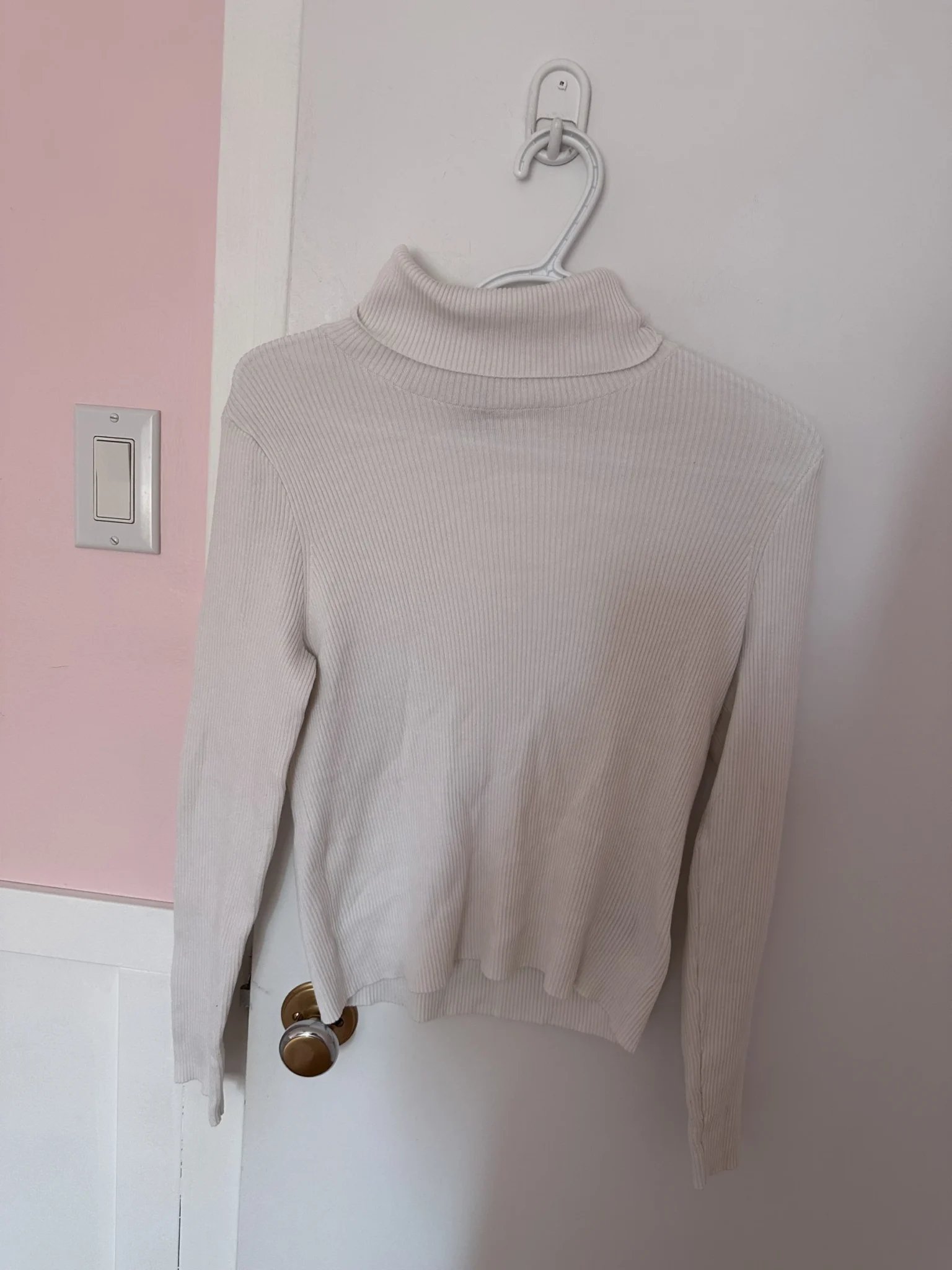 Featured image for White ribbed roll-neck jumper