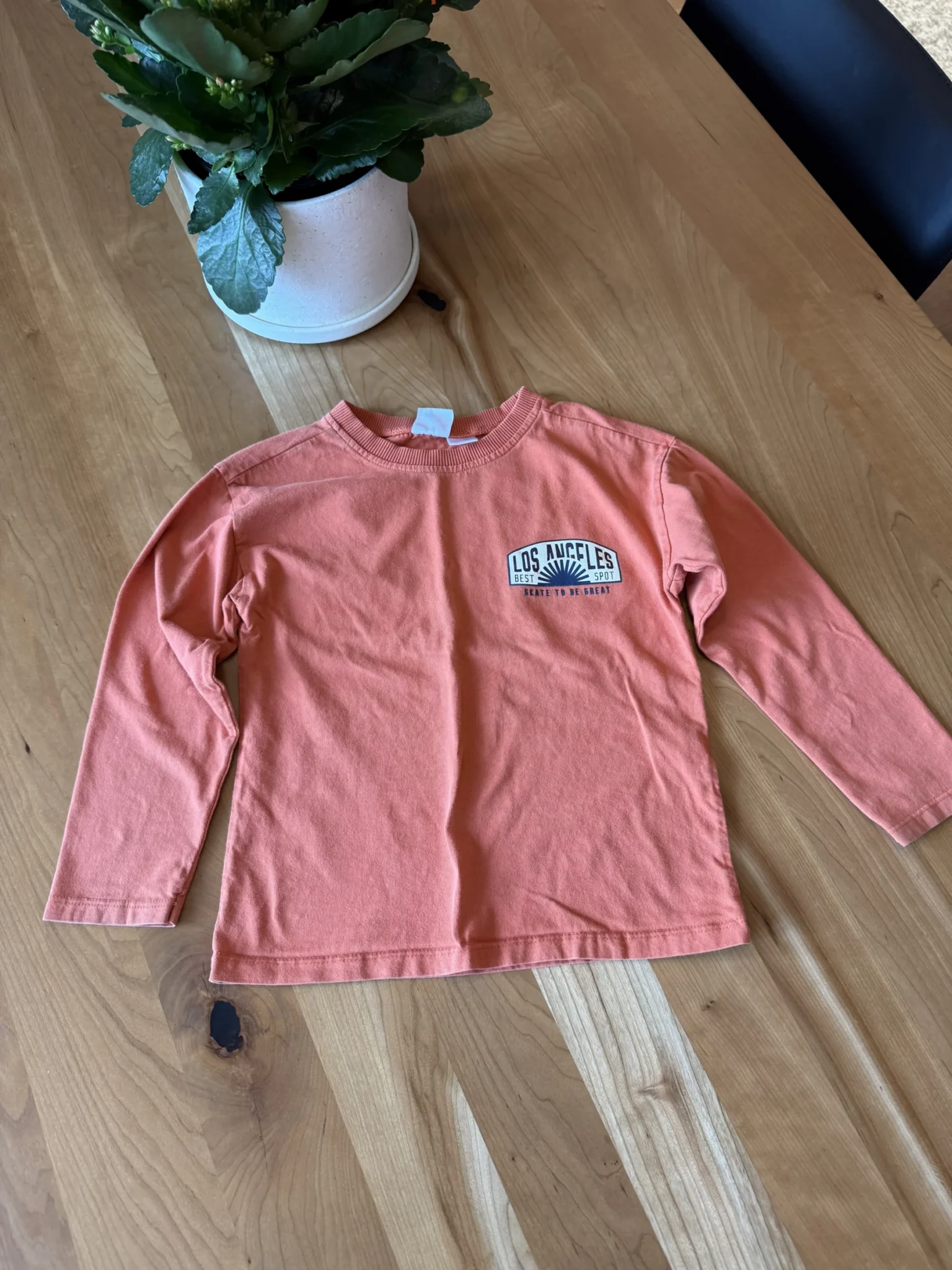 Featured image for Orange long-sleeved Los Angeles