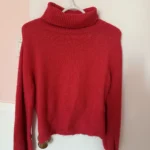 Featured thumbnail for Red roll-neck jumper
