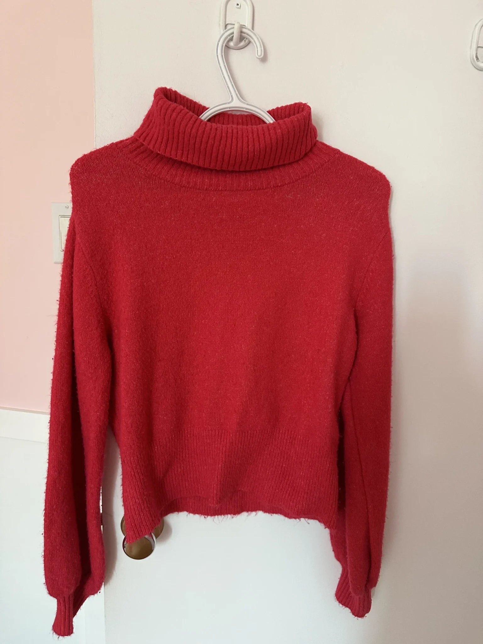 Featured image for Red roll-neck jumper