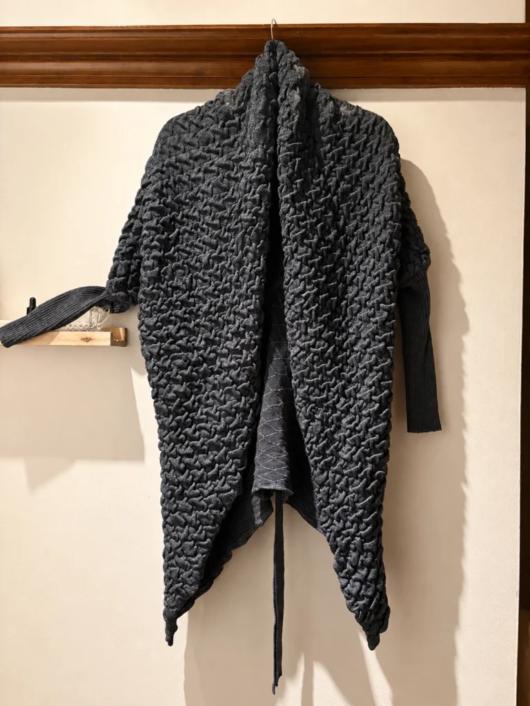 Featured image for Long, dark grey cardigan with a textured knit – asymmetrical draped cut