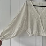 Featured thumbnail for Petit haut crème à manches chauve-souris