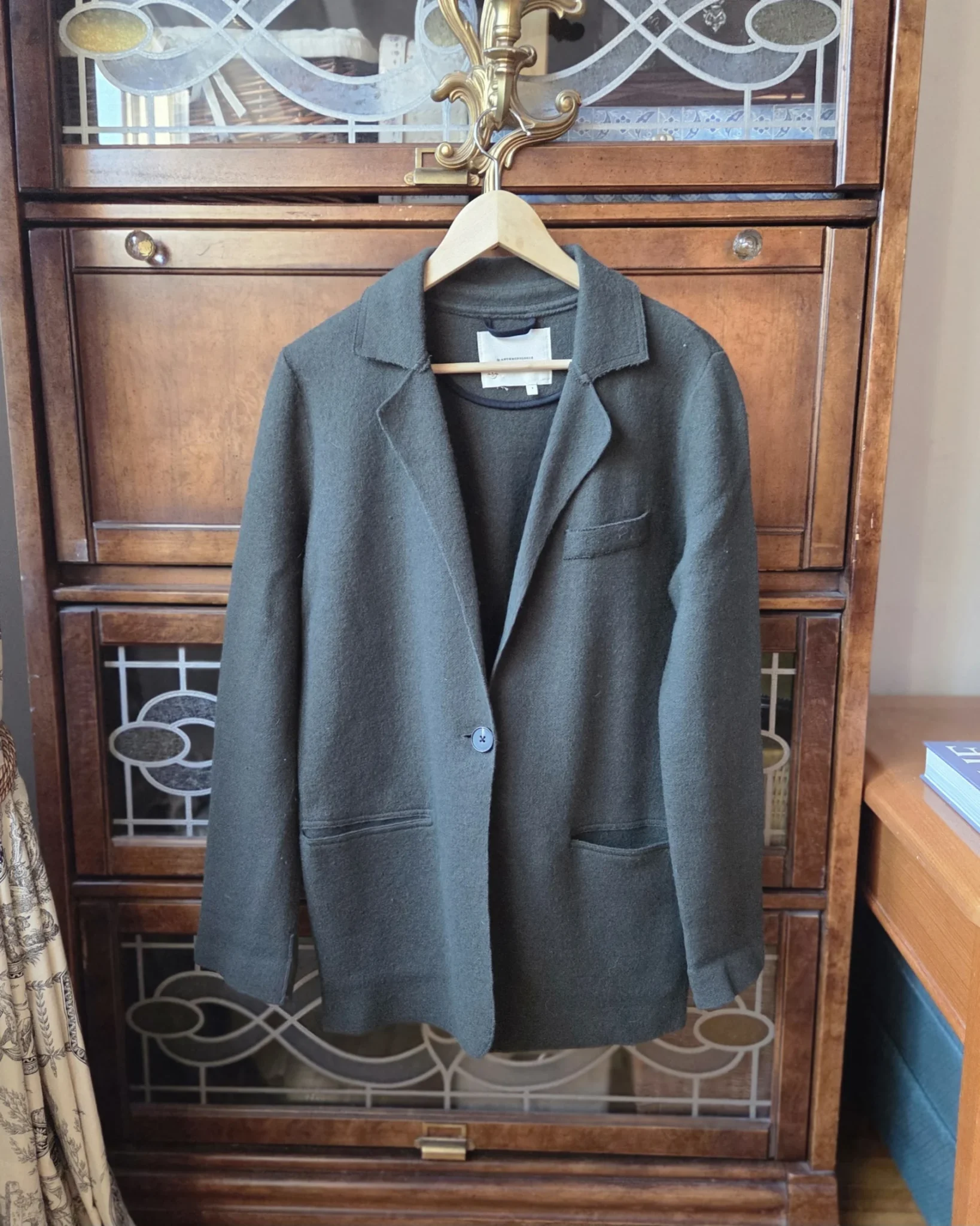 Featured image for Stylish dark green cardigan from Anthropologie, made from a wool and cotton blend