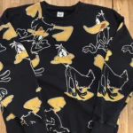 Featured thumbnail for AIME WO – All-over Daffy Duck sweatshirt – The Alternative Syndrome