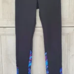Thumbnail for Black leggings with a floral pattern at the bottom