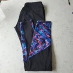 Thumbnail for Black leggings with a floral pattern at the bottom