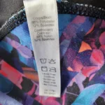 Thumbnail for Black leggings with a floral pattern at the bottom