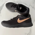 Featured thumbnail for Nike – Black and rose gold trainers