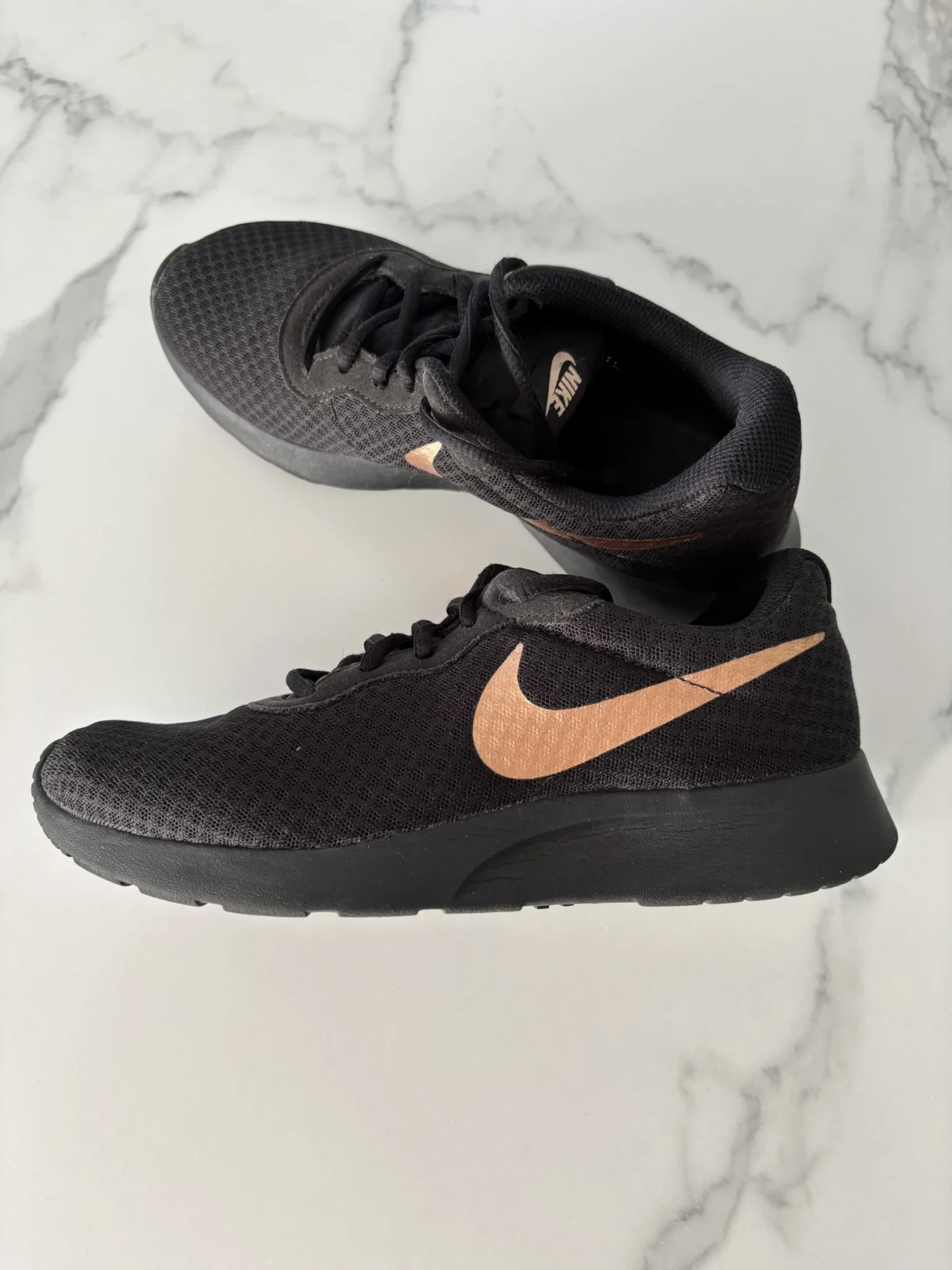 Featured image for Nike – Black and rose gold trainers