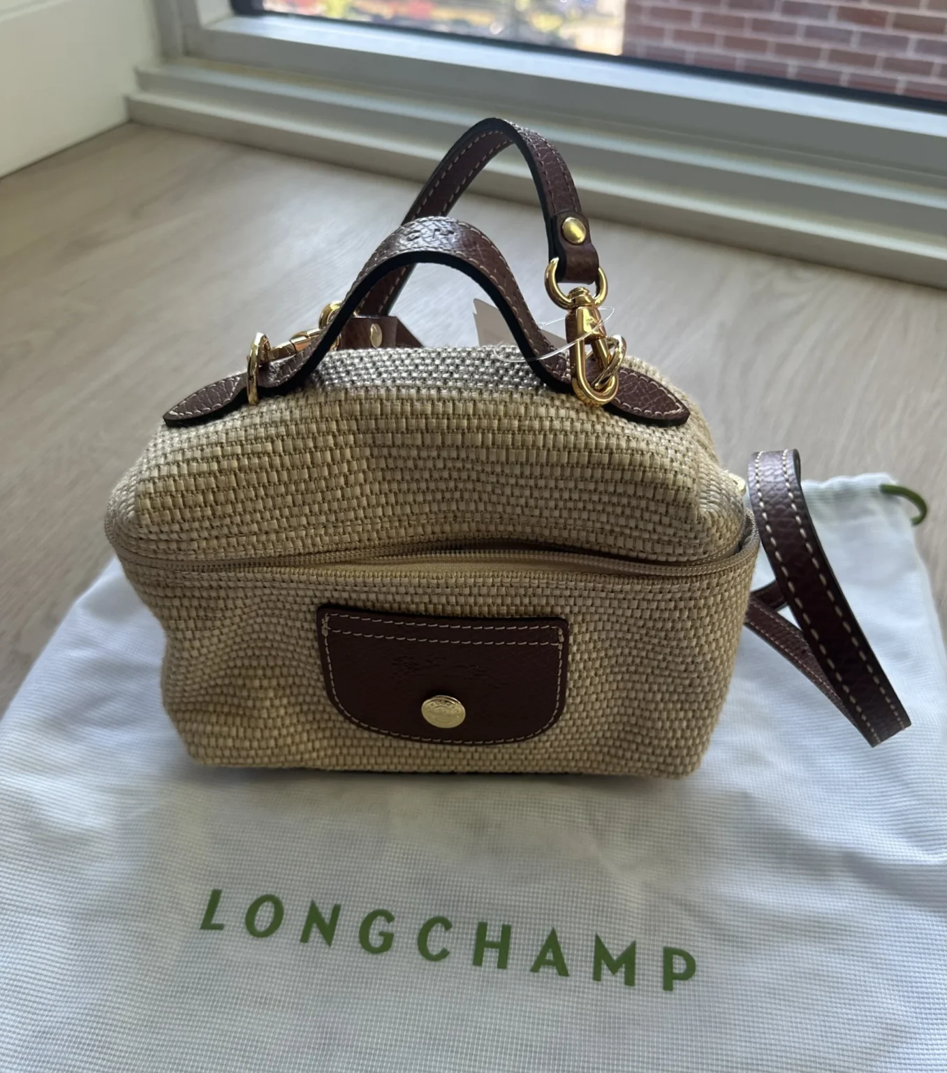 Featured image for Longchamp Le Pliage Straw Crossbody Bag